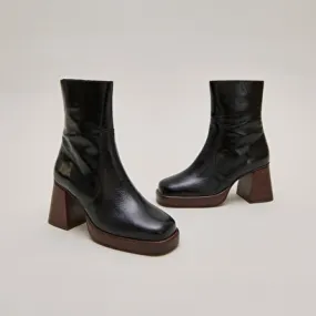 Platform ankle boots in black shiny leather