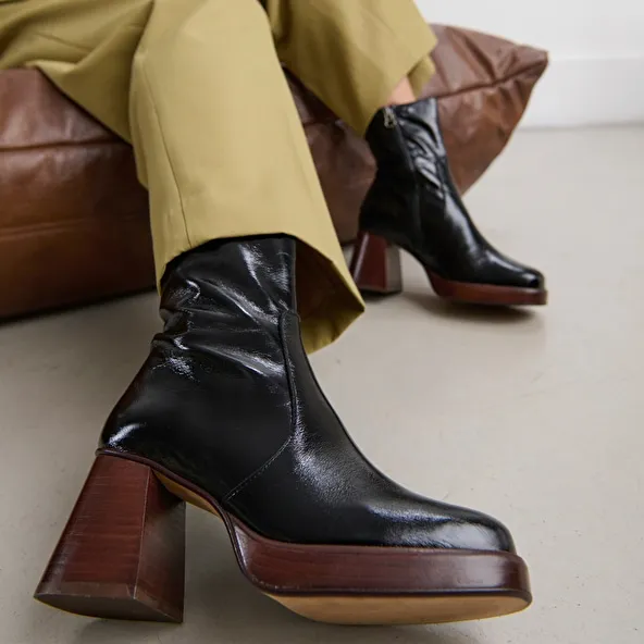 Platform ankle boots in black shiny leather